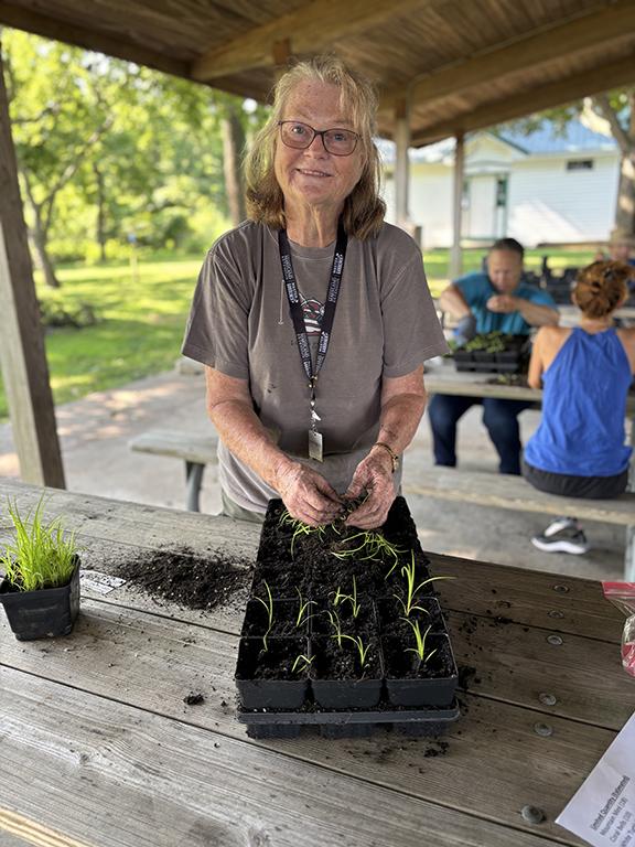 Master Gardener Dona Roderick divides native plants