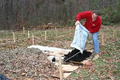 cardboard covered with bagged compost